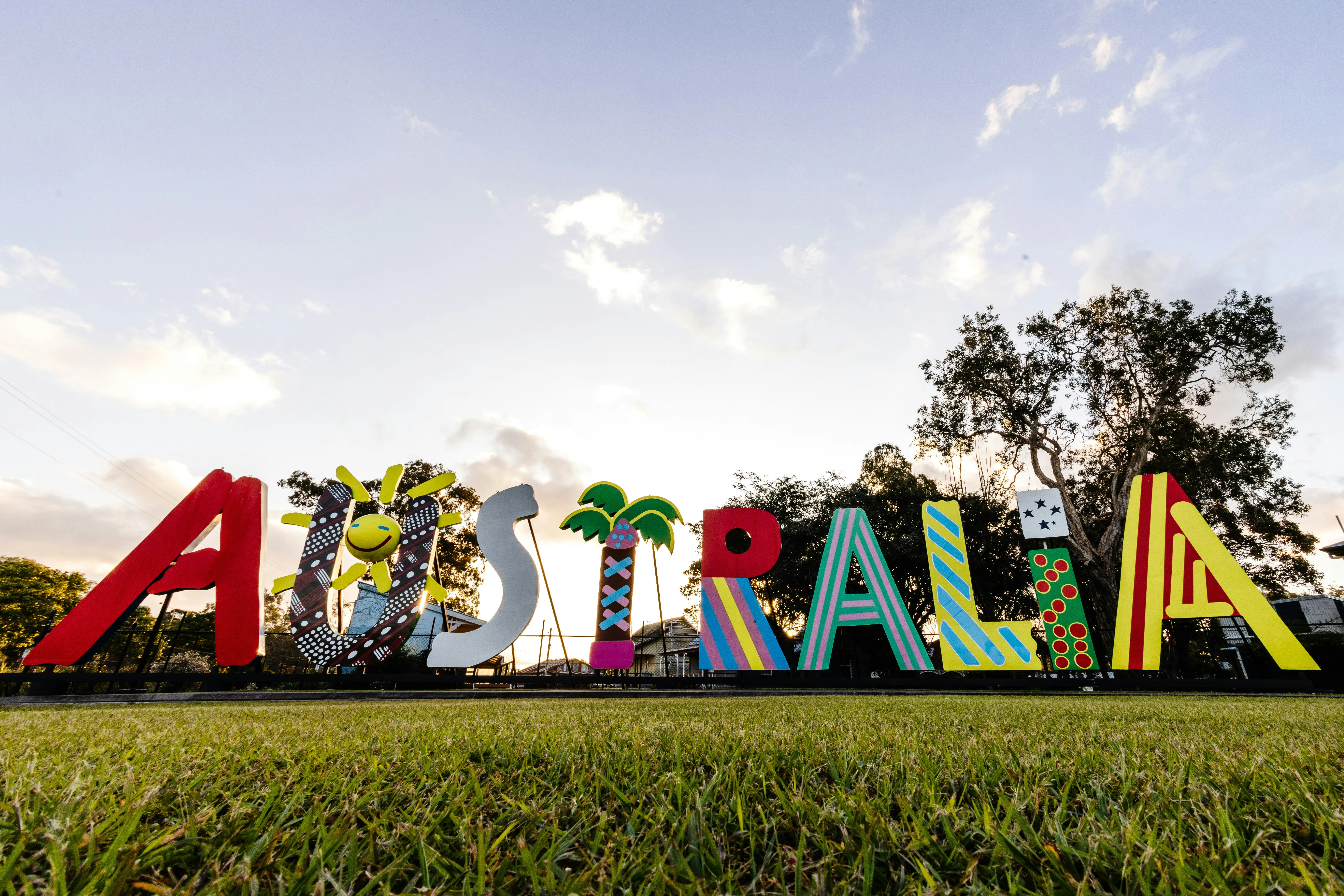 Giant colourful AUSTRALIA letter sculpture at sunset